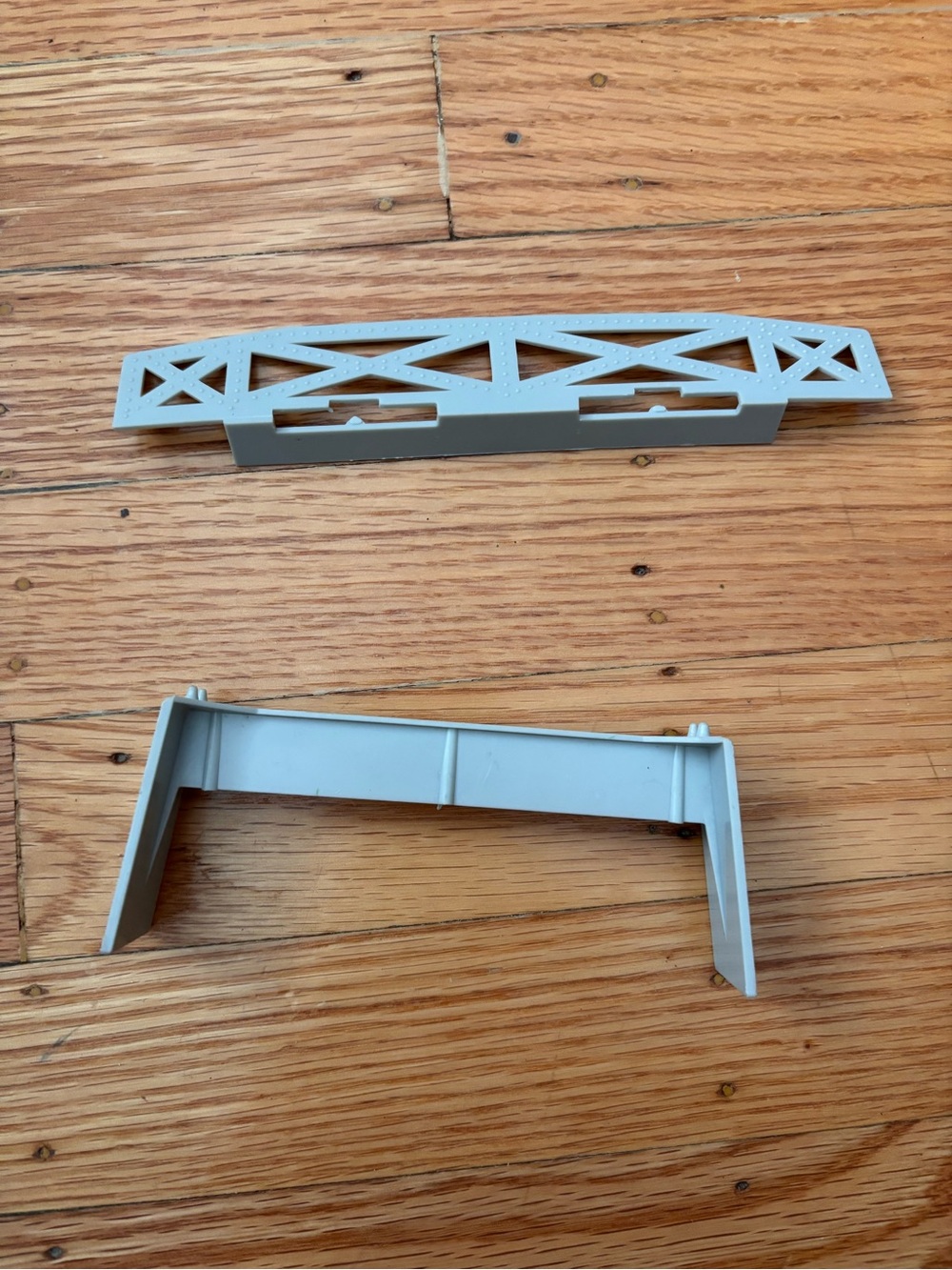 Mystery miniatures 
Light Gray Plastic Piece of a Toy Set